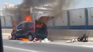Bir anda alev alan aracını söndürmek isterken yaralandı