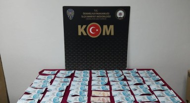 İzmir'de otomobilinde sahte para bulunan kişi gözaltına alındı